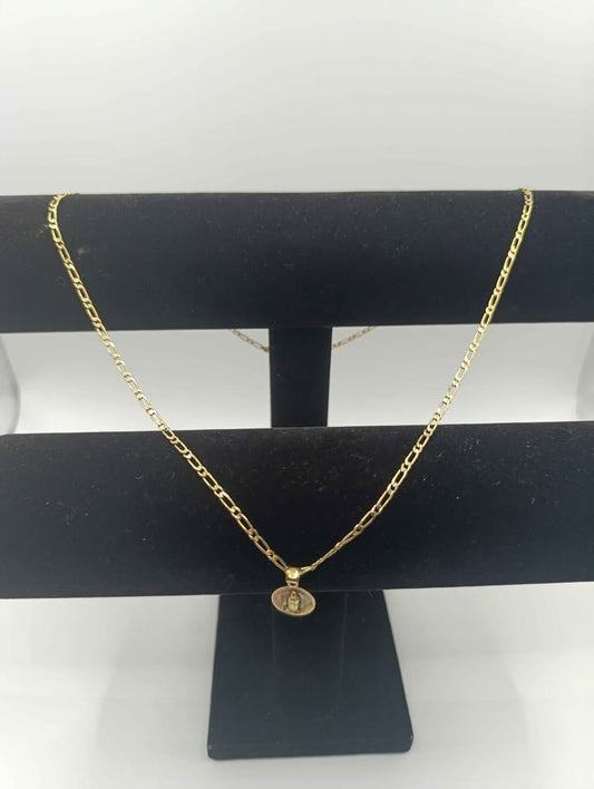 Cadena tejido 1*1 con dije religioso de oro 10k 7.8 gr 29 cm abrochada