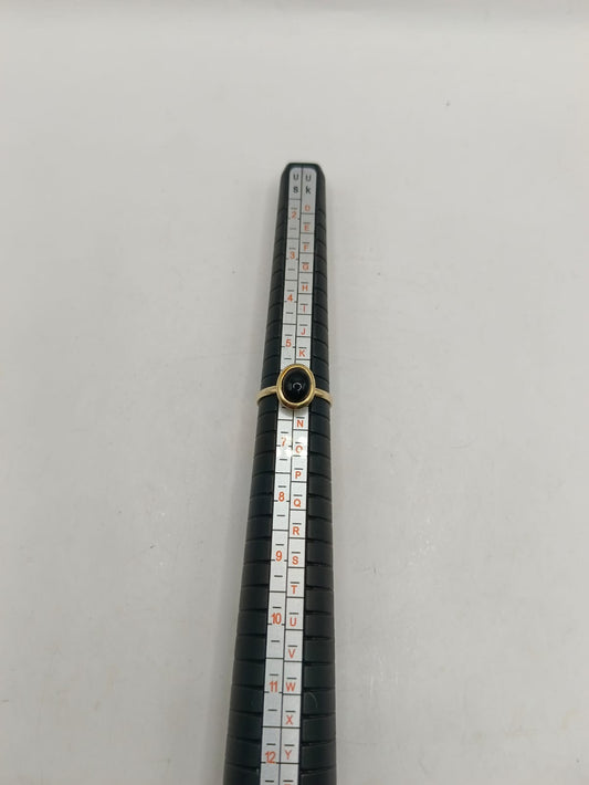 Anillo sintetico negro ORO 10k peso 1.5gr, usado