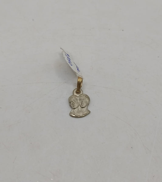 Dije dos caras ORO 10k peso .9gr, usado