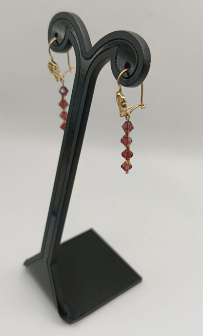 Aretes sintetico cafe ORO 10k peso 2gr, usado