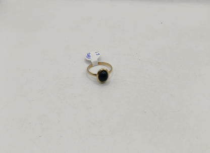 Anillo sintetico negro ORO 10k peso 1.5gr, usado