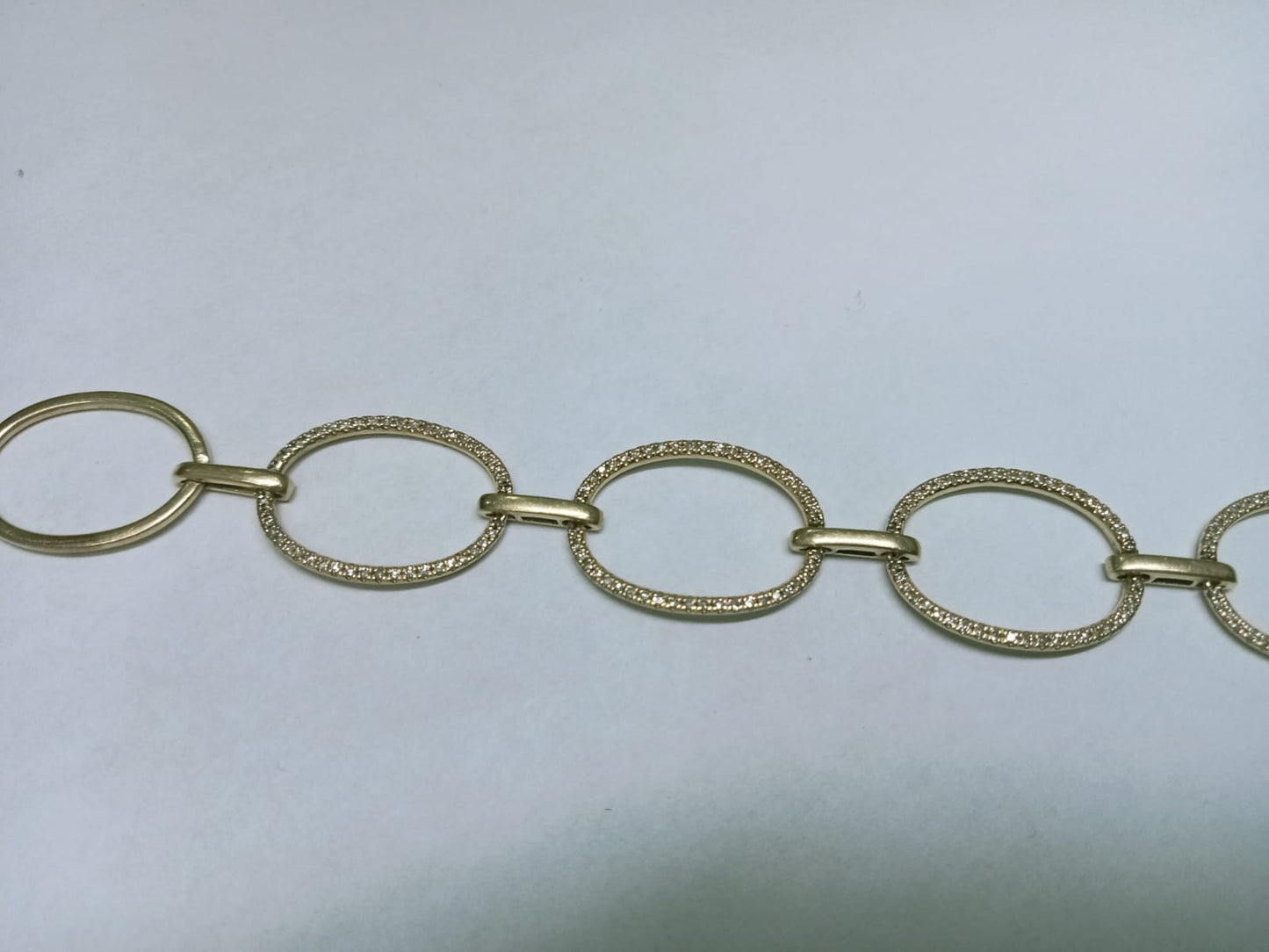 Pulsera de Oro 10k – Aros Entrelazados con Chispitas