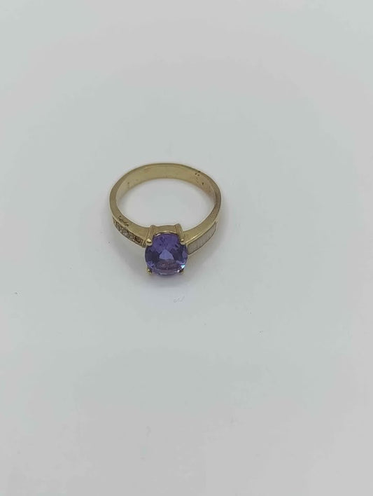 Anillo de oro con piedra morada 10k 2.5 gr #6.5
