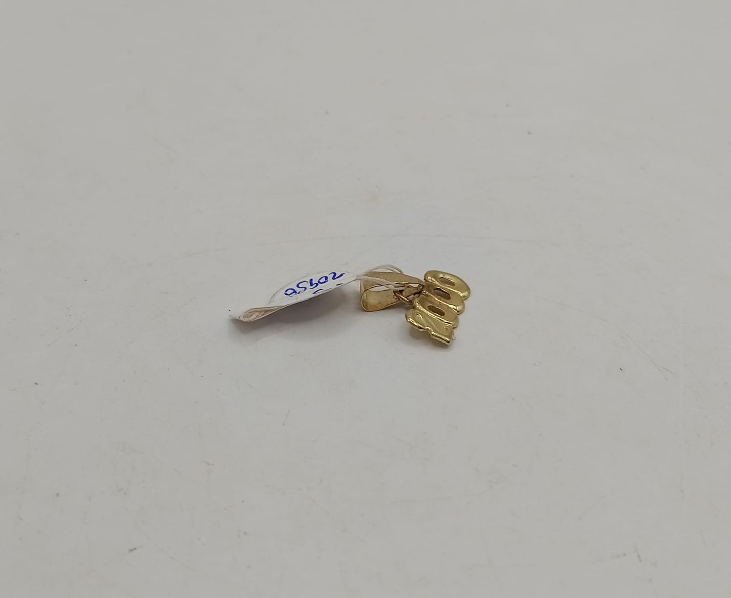 Dije #2000 ORO 10k peso .5gr, usado