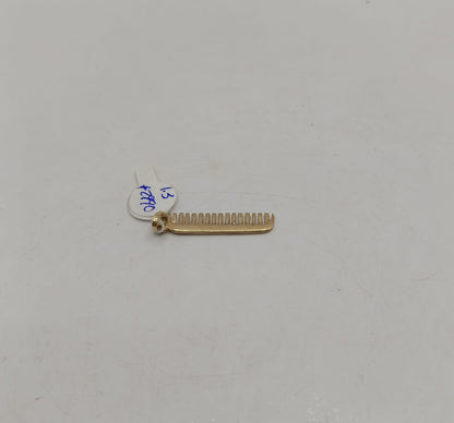 Dije de peine ORO 10k peso 1.3gr, usado