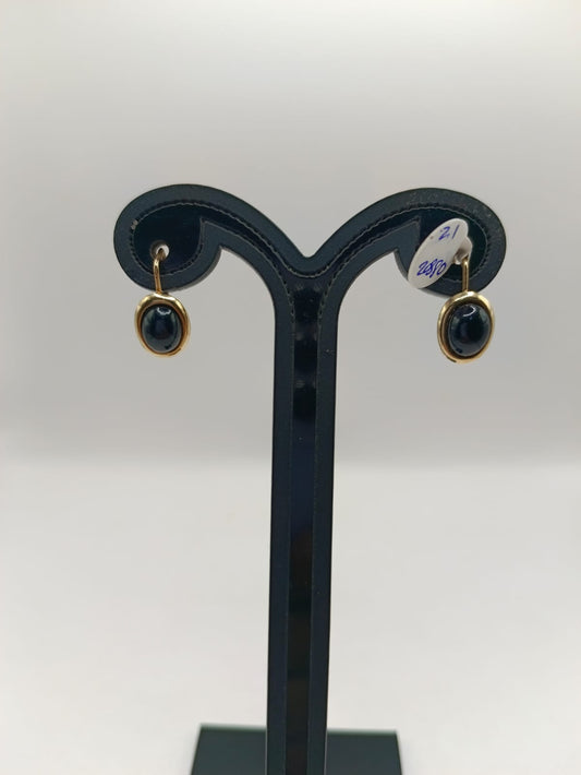 Aretes sintetico negro ORO 10k peso 2.1gr, usado
