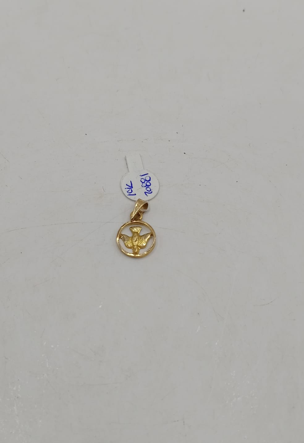 Dije de paloma ORO 10k peso .9gr, usado