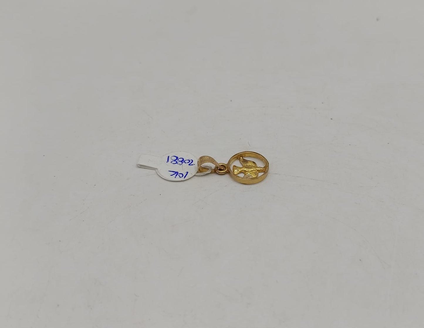 Dije de paloma ORO 10k peso .9gr, usado