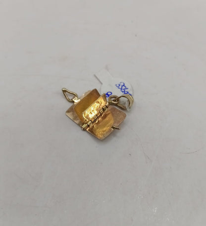 Dije de libro ORO 10k peso 1.8gr, usado