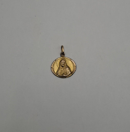 Dije sagrado corazon ORO 10k peso 1gr, usado