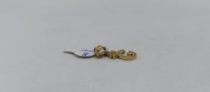 Dije de letra G ORO 10k peso .8gr, usado