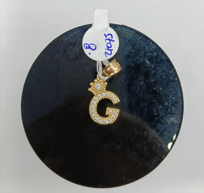 Dije de letra G ORO 10k peso .8gr, usado