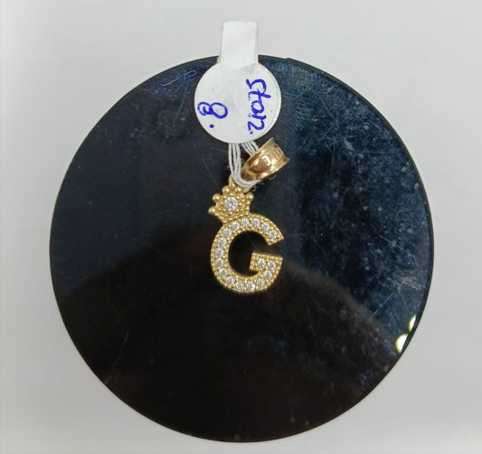 Dije de letra G ORO 10k peso .8gr, usado