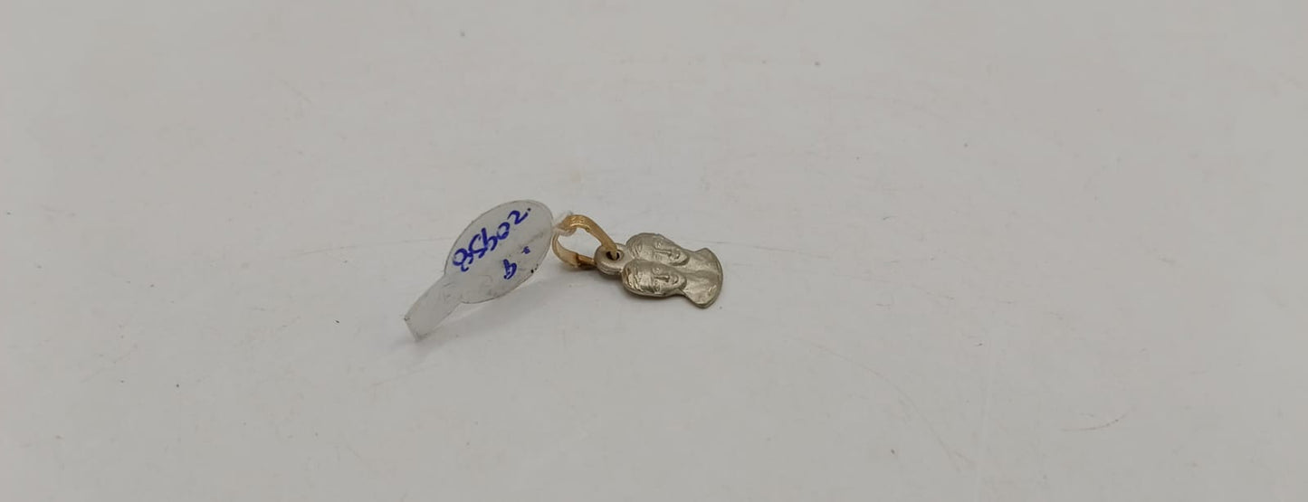 Dije dos caras ORO 10k peso .9gr, usado