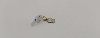 Dije dos caras ORO 10k peso .9gr, usado