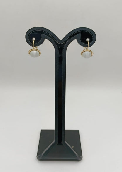 Aretes sintetico blanco ORO 10k peso 1.9gr, usado
