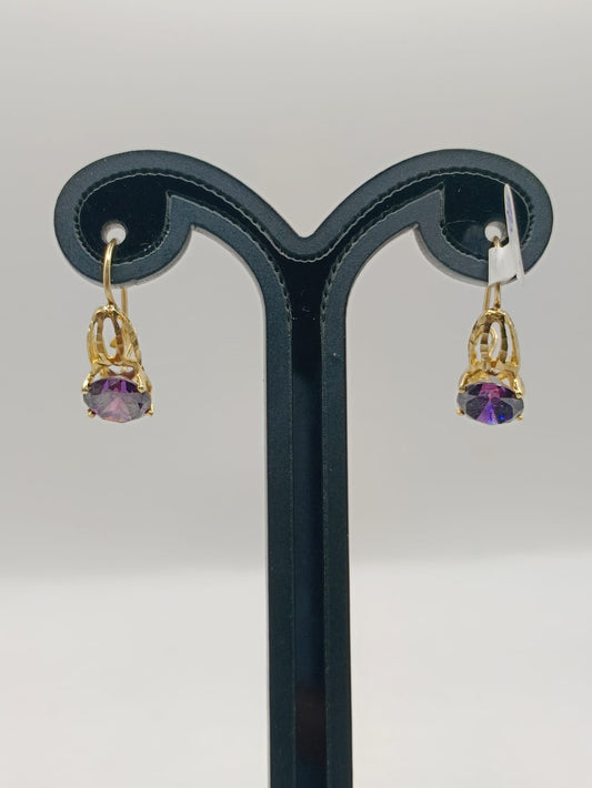 Aretes con sintetico morado ORO 10k peso 3.2GR, usado